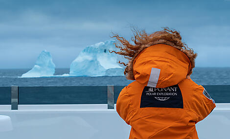 Unexplored East Antarctica & French Southern Lands-00098_CC140223_Guest_Parka_Iceberg_Antarctica_©PONANT-Photo-Ambassador-Ian Dawson.JPEG